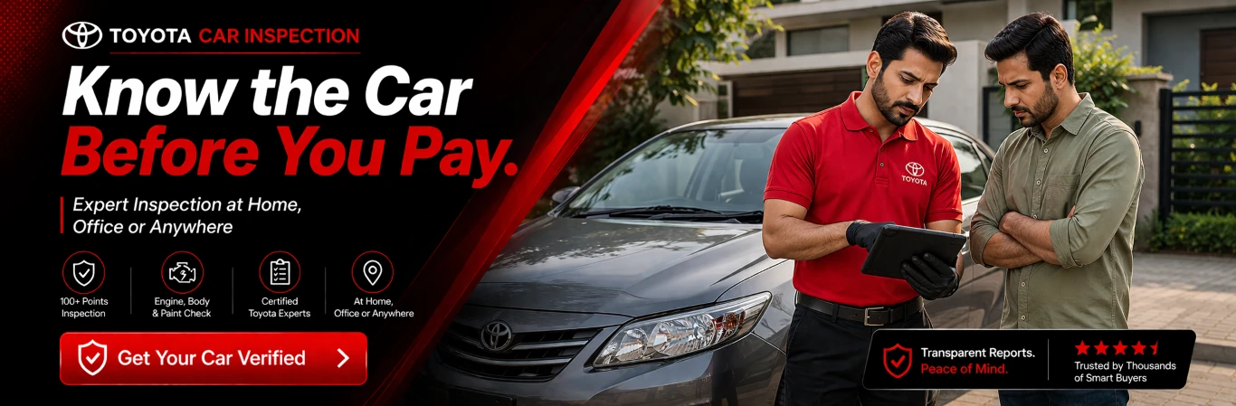 Toyota inspection expert checking used car paint and condition before purchase